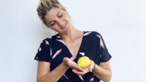Abbey holding a lemon for 14 weeks pregnant